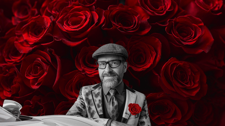CJB TODAY MUSIC IMAGE OF CJB IN GREY SUIT WITH RED FLOWER AND ROSES BACKRGOUND